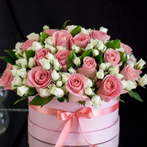 Beautiful Arrangement of Pink Roses and White Spray Roses in Round Pink Box